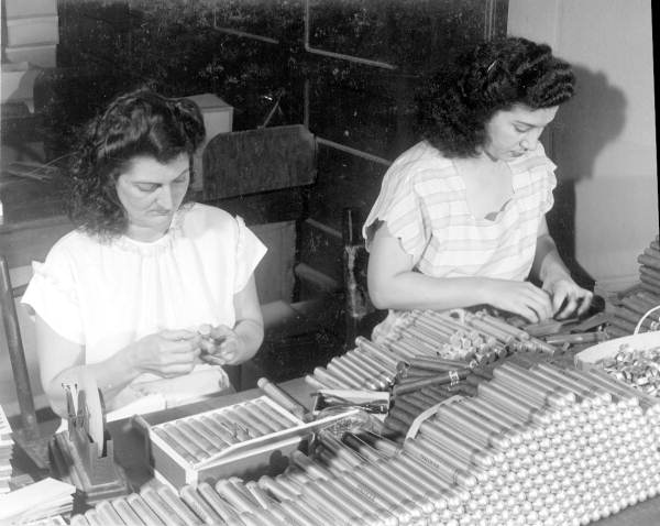 Mirta Perez and Angie Valdez working on cigar packaging process - Tampa, Florida