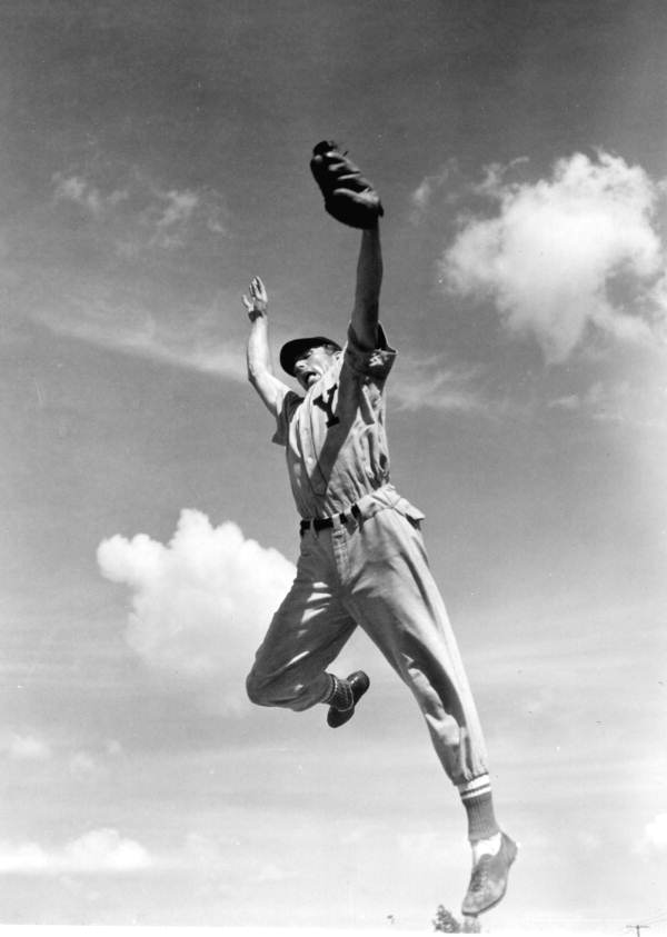 Outfielder Elson Konzen grabs a high one.