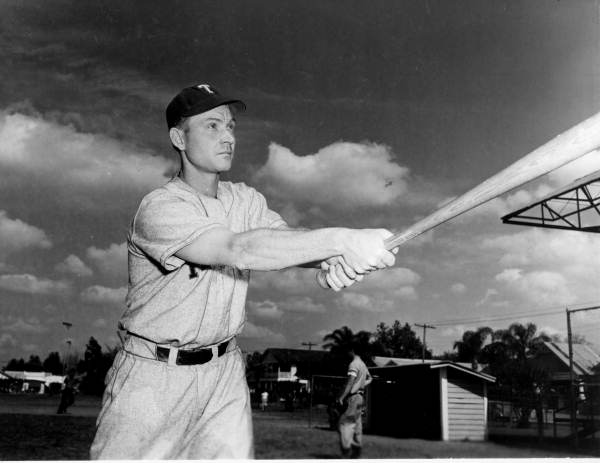 Charlie "Red" Roberts demonstrates "breaking wrist" for power drive to class.