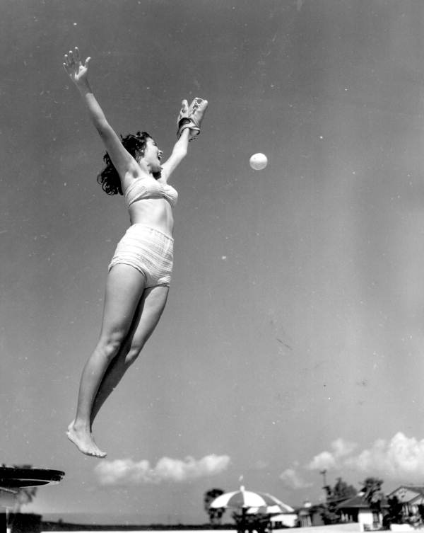 Fielder , Jeanne Crow in the air just misses the ball - Saint Petersburg, Florida 