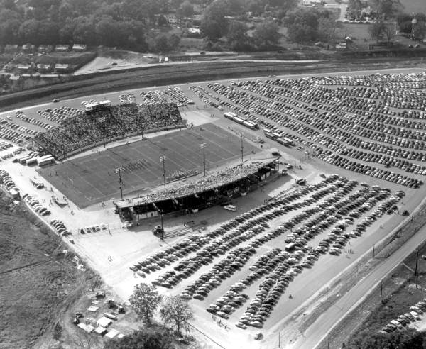 Aerial view of Doak Campbell Stadium with surrounding parking lot during dedication football game - Tallahassee, Florida