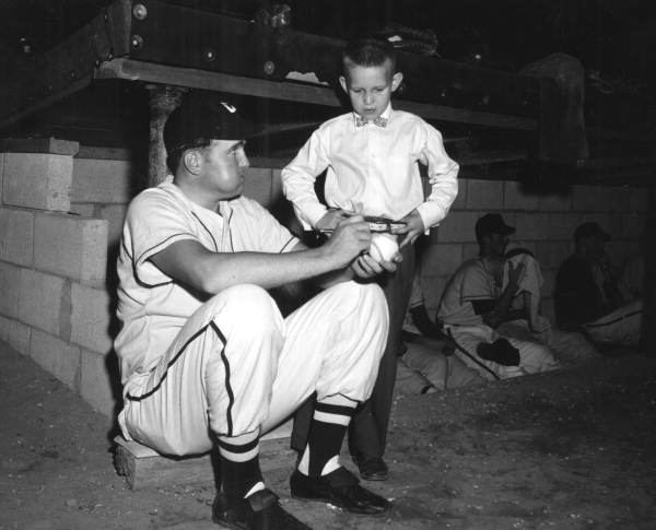 Minor League batting champ Neal Cobb signing baseball for fan - Crestview, Florida