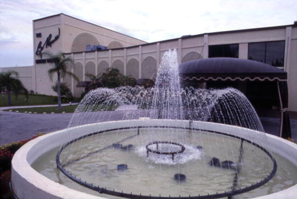 View looking toward the Burt Reynolds Dinner Theatre with water fountain in foreground - Jupiter, Florida.