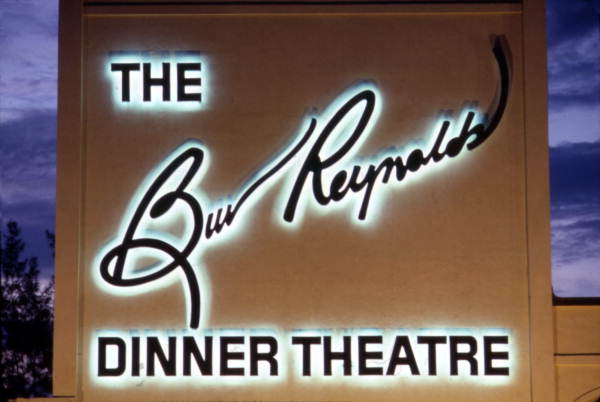 Close-up view showing the Burt Reynolds Dinner Theatre sign at night - Jupiter, Florida.
