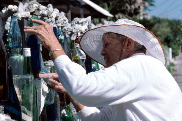 Carolyn Gorton Fuller working on her "bottle wall fence" - Key West, Florida