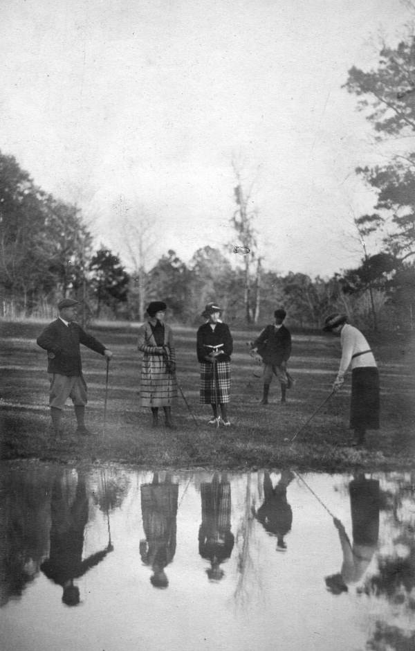 Dr. William E. Van Brunt, left, golfing with women in Tallahassee, Florida.