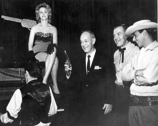 Florida Governor Farris Bryant poses with employees of Six Gun Territory tourist attraction at the Florida State Fair