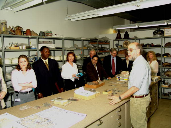 Archaeologist Dave Dickel talking to members of the House Transportation and Economic Development Appropriations Committee during a tour of the R.A. Gray building