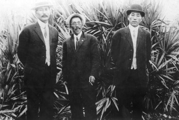 Three Japanese American men posing for a picture