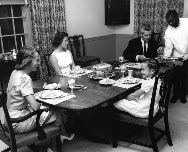 Governor LeRoy Collins and wife dining with two of their daughters