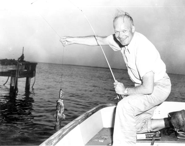 General Dwight Eisenhower landing a grouper.