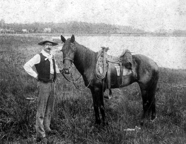 Tom Johnson holding the reins of his horse - Orlando, Florida