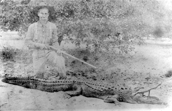 Clifford Lucky kneeling over an alligator he capturedAlva, Florida