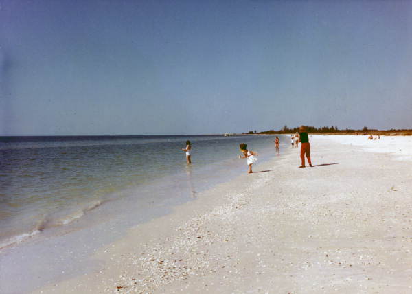 People enjoying the beach at Marco Island in Collier County, Florida.