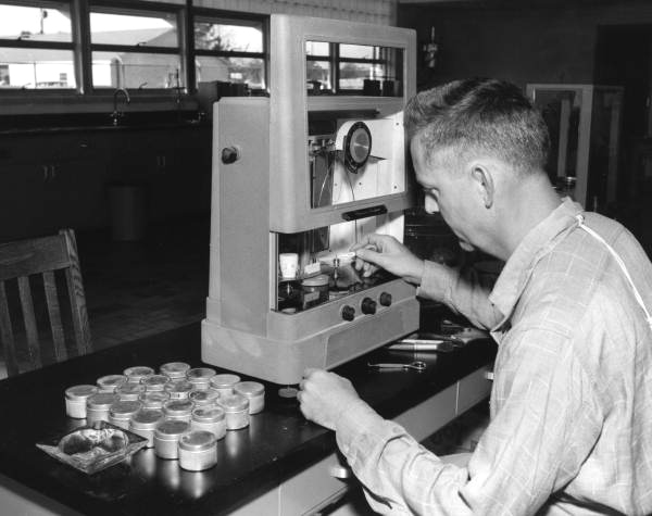 Unidentified man works with scientific equipment - Gainesville, Florida.