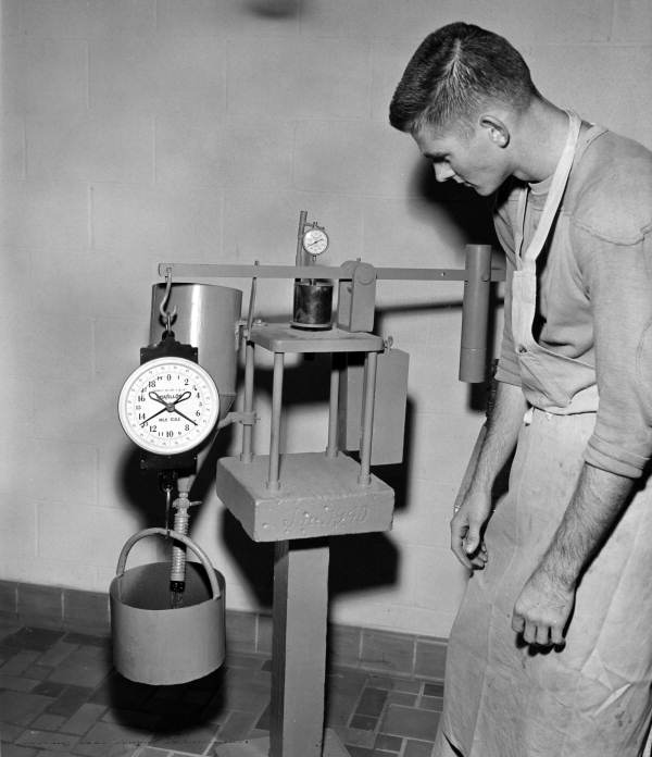 Unidentified man with a bearing value machine - Gainesville, Florida