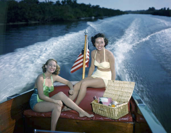 Photographer's daughter Lois Duncan Steinmetz, left, and friend Polly Gaines in a motorboat.