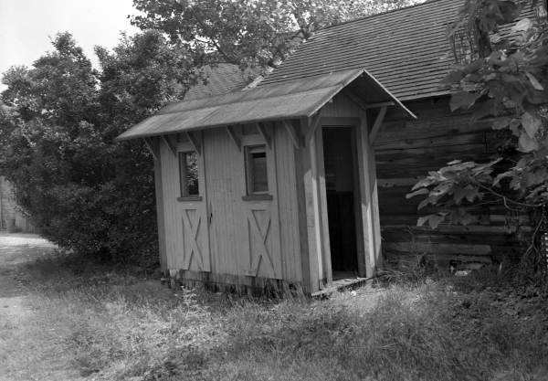 Large two-sided outhouse.