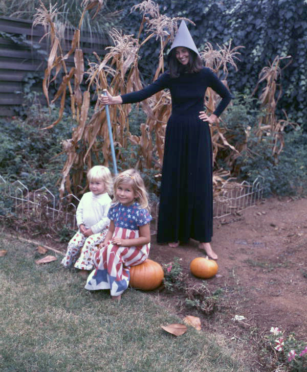 View showing Carolyn Steinmetz, dressed as a witch for Halloween, with children in Sarasota, Florida.