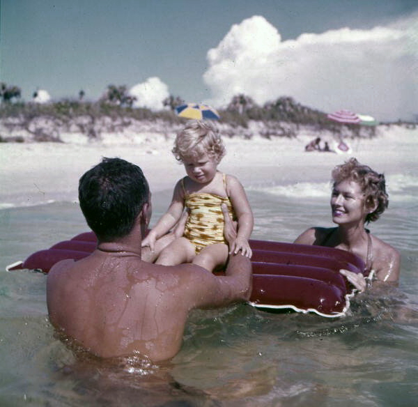 Nelson family in the Gulf with a raft near Sarasota, Florida.