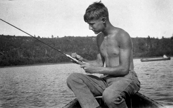 Photographer Joe Steinmetz, as a young man, fishing at Camp Megunticook near Camden, Maine.