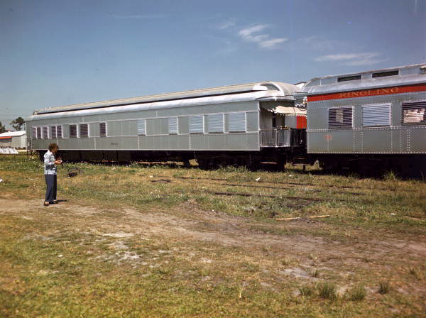 Photographer's wife, Lois Foley Steinmetz, photographing the Ringling Circus train at its winter quarters in Sarasota, Florida.