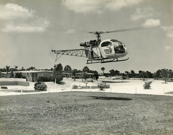 Helicopter arriving at the Colony Beach Resort hotel on Longboat Key, Florida.