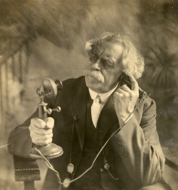 Koreshan Dr. James Russell Price using a telephone.