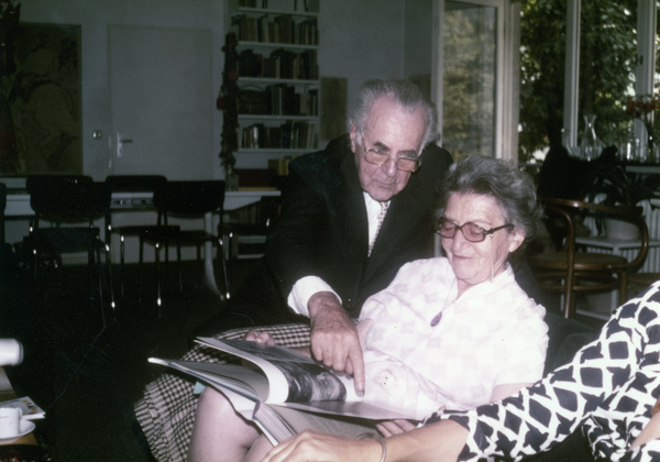 Ferdi Kramer, left, viewing book with Koreshan Unity president Hedwig Michel.