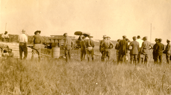 Koreshan men in field.