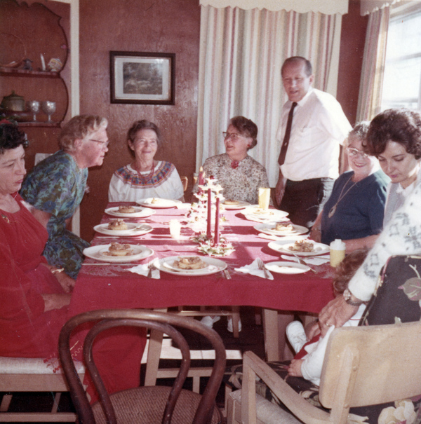 Koreshan Unity president Hedwig Michel eating with people on Christmas day.