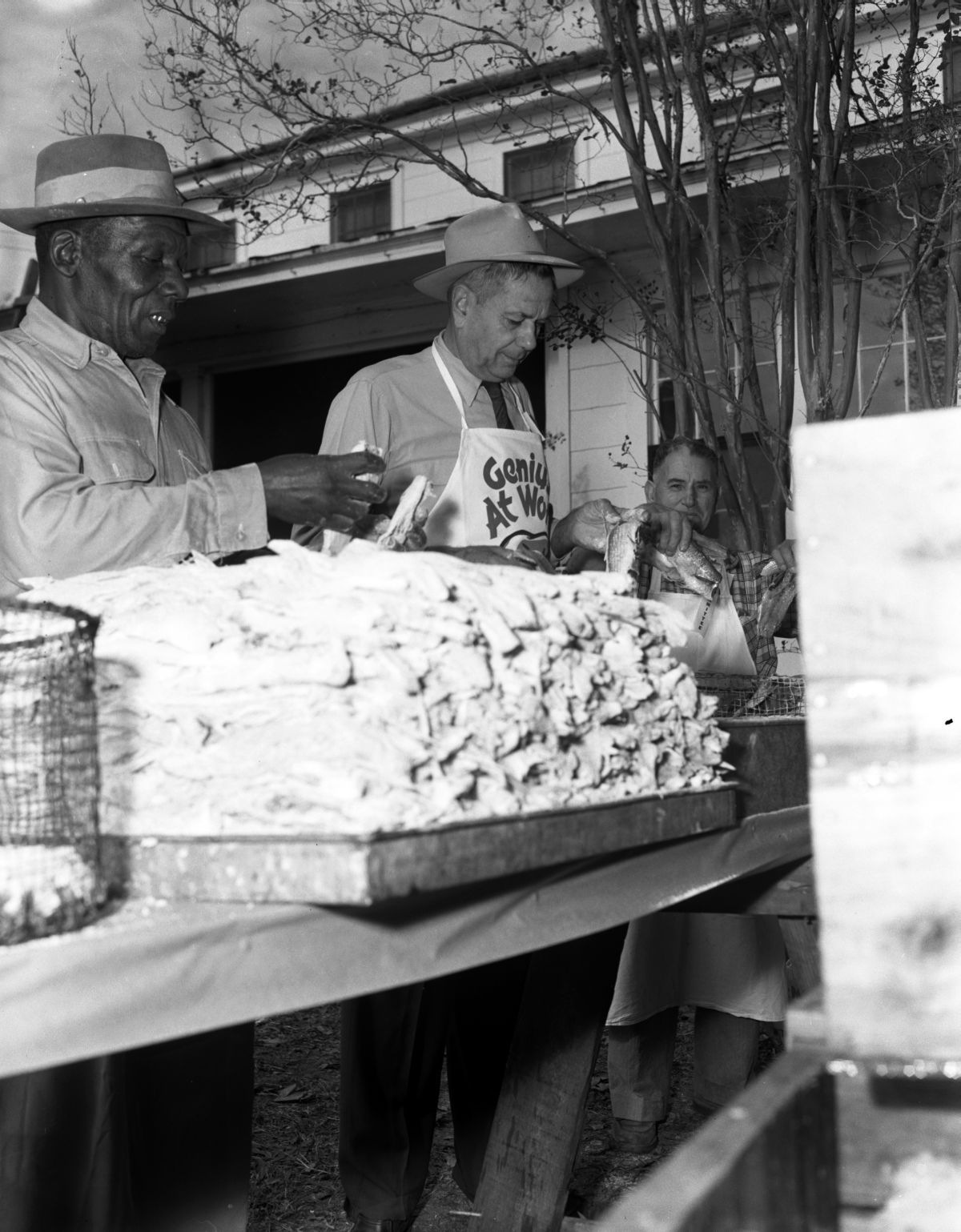 Men preparing to fry mullet for the Harbor Day Seafood Festival in Apalachicola (1957).