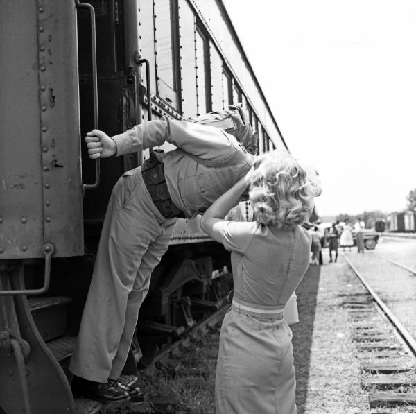Beth Brown kissing Marine Corporal Travis Taylor goodbye at the train in Tallahassee.
