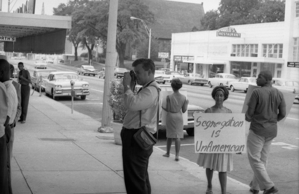 Photographer taking pictures of CORE members picketing the Florida Theatre in Tallahassee.