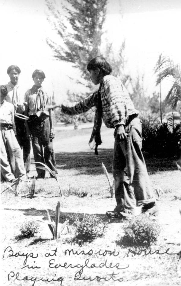 Seminole boys playing quoits at the Mission