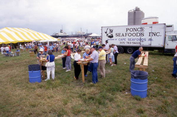 People eating at the SeaFest seafood festival in Port Canaveral, Florida.