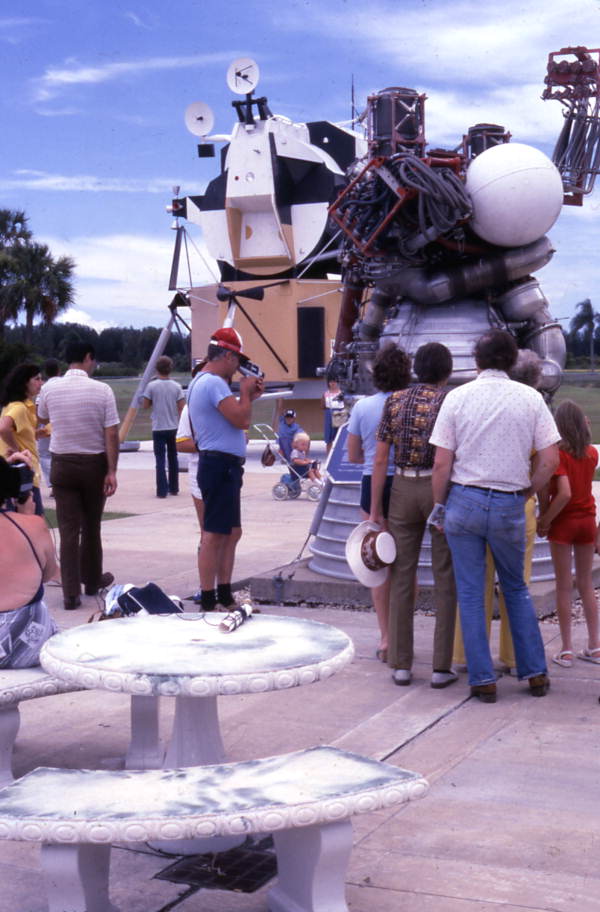 Visitors looking at the Saturn V J-2 rocket engine in the Kennedy Space Center rocket garden on Merritt Island near Titusville, Florida.