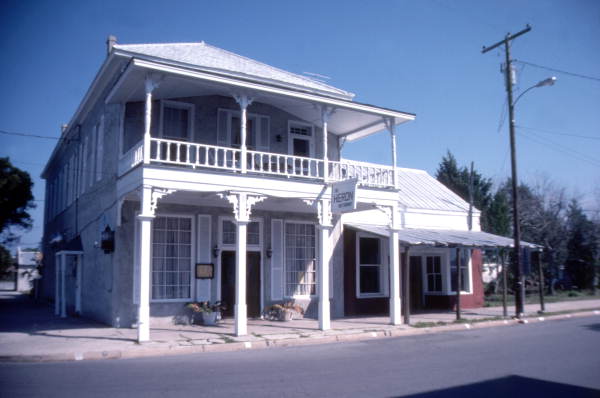 View showing The Heron restaurant in the Hale Building on the northeast corner of 2nd and D streets in Cedar Key, Florida.