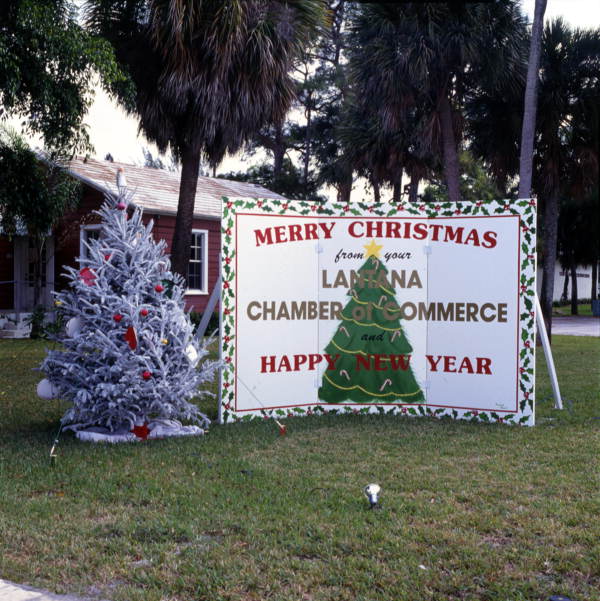 Christmas sign and tree in Lantana, Florida.