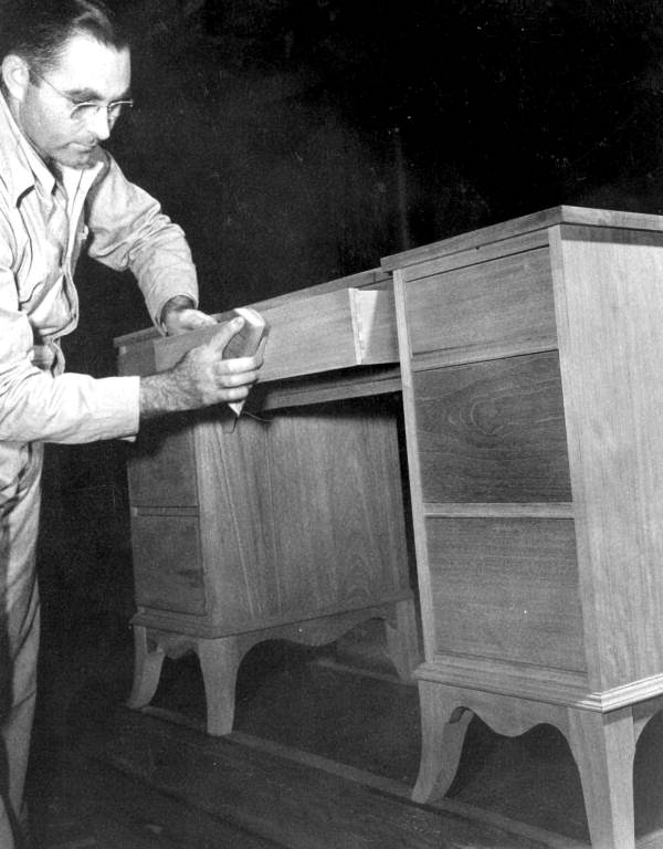 D.F. Thompson Jr. sands a vanity - Pensacola, Florida .