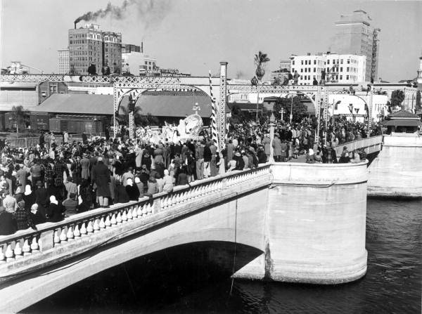 Large crowd lined along the Lafayette Bridge during the Gasparilla festival - Tampa, Florida.