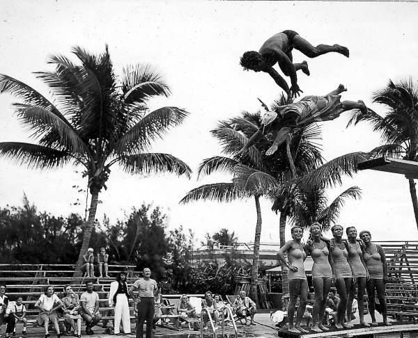 Men diving into pool at the Vanderbilt Hotel - Miami Beach, Florida