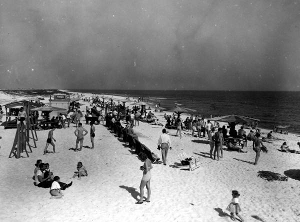 People enjoying the sun and surf.