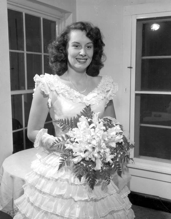 May Day party queen Doris Underwood holding bouquet - Tallahassee, Florida