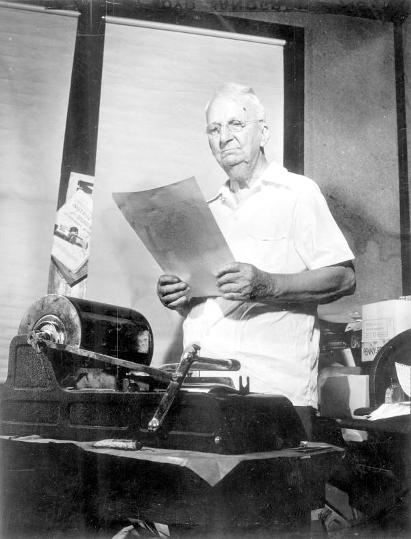 William F. Hawley prepares to print his newspaper - Arlington, Florida