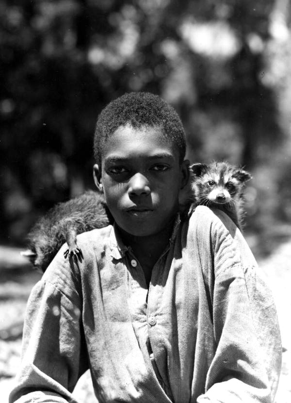 Lydell Jones with small raccoons
