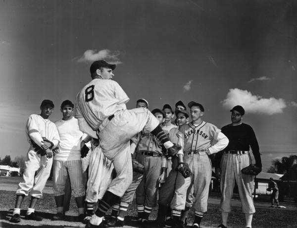 Cincinnati Reds pitcher Johnny Vander Meer demonstrating technique to students - Tampa, Florida.