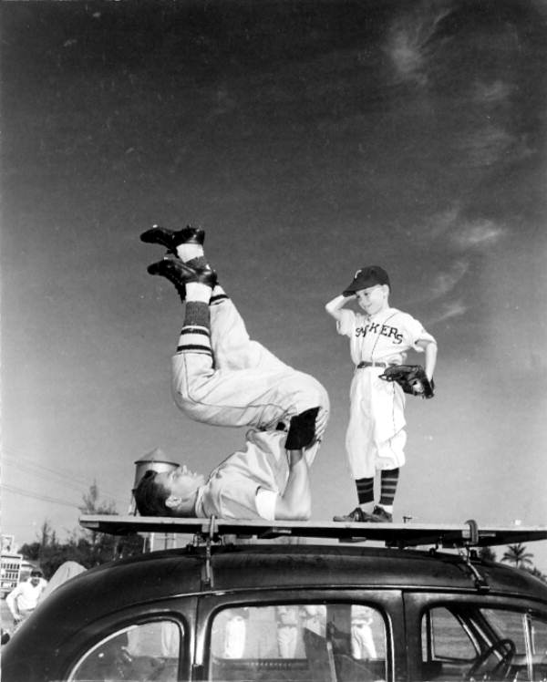 Jim Cacciola exercises while Jimmy Mott watches - Tampa, Florida