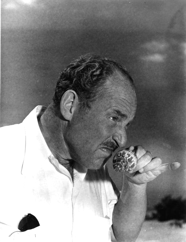 Truman T. Metzel smelling a stinky shell - Sanibel Island, Florida.