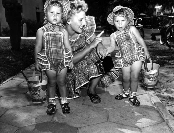 Twins with their mother for a contest - Saint Petersburg, Florida.